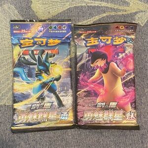 2 Pokémon Booster Packs – Lucario & Typhlosion Art – 25 Cards Each